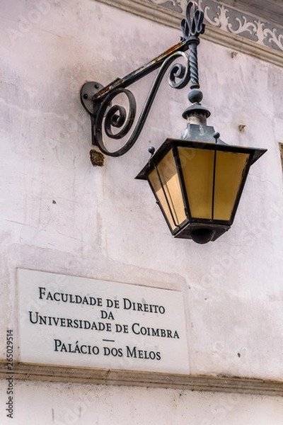 Fototapeta View of retro street lamp, in University of Coimbra , law department building