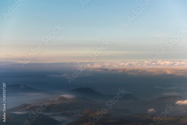 Fototapeta Dawn between fog in mountain ranges of the Colombian Andes