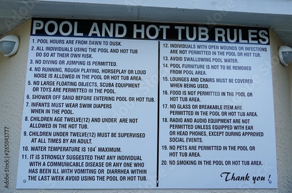Obraz Sign at a resort or homes association pool stating the rules for use of pool and hot tub.