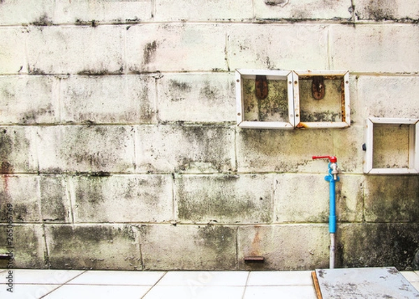 Obraz Old Block with blue Pipe and Tap