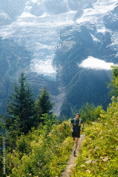 Fototapeta A runner enjoying the beautiful trails in the Mont Blanc range above Chanomix.