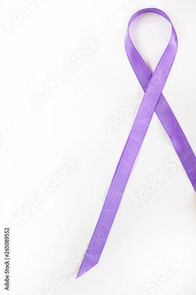 Fototapeta long lavender ribbon as symbol of fight against cancer on white background. Top view. Vertical, with copy space, isolated. Concept