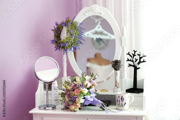 Fototapeta wedding bouquet and cup of tea on the bedside table with mirror