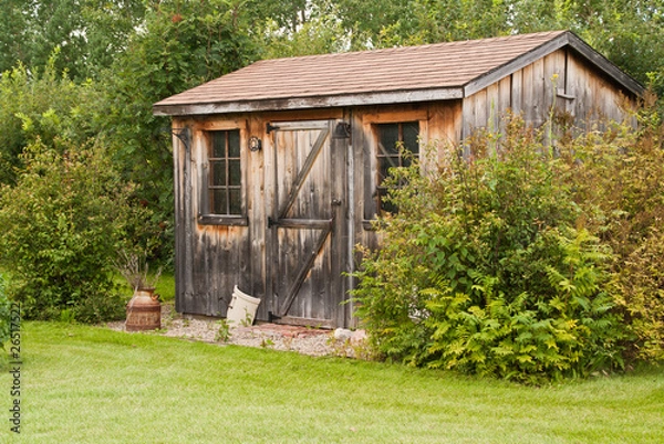 Fototapeta A charming, rustic garden shed made from reclaimed timber