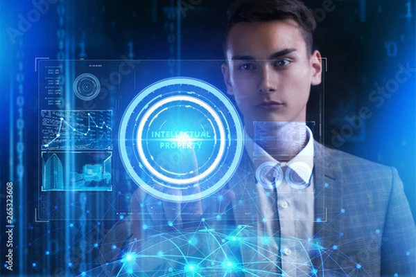 Fototapeta The concept of business, technology, the Internet and the network. A young entrepreneur working on a virtual screen of the future and sees the inscription: Intellectual property