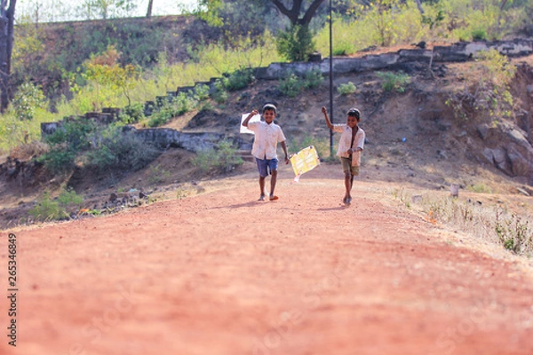 Fototapeta indian child playing with kite