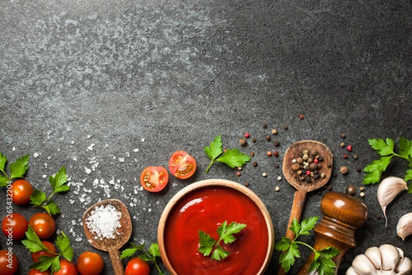 Fototapeta Cooking background with spices, tomatoes and sauce
