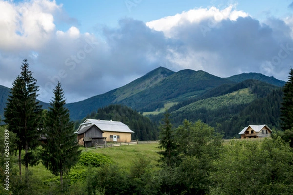 Fototapeta Scenic summer or spring mountain view with cloudy sky. Ukraine, Carpathians, Dzembronia High mountains in vivid color. Nobody. Beautiful mountain lanscape or valley.