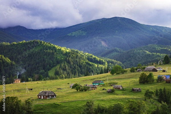 Fototapeta Scenic summer or spring mountain view with cloudy sky. Ukraine, Carpathians, Dzembronia High mountains in vivid color. Nobody. Beautiful mountain lanscape or valley.