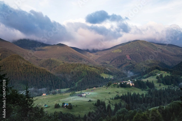 Fototapeta Scenic summer or spring mountain view with cloudy sky. Ukraine, Carpathians, Dzembronia High mountains in vivid color. Nobody. Beautiful mountain lanscape or valley.