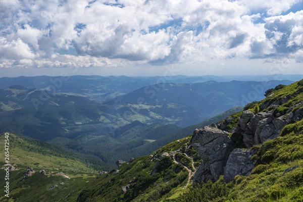 Fototapeta Scenic summer or spring mountain view with cloudy sky. Ukraine, Carpathians, Dzembronia High mountains in vivid color. Nobody. Beautiful mountain lanscape or valley.
