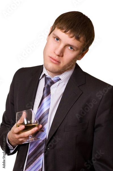 Fototapeta tired business man with a glass of cognac