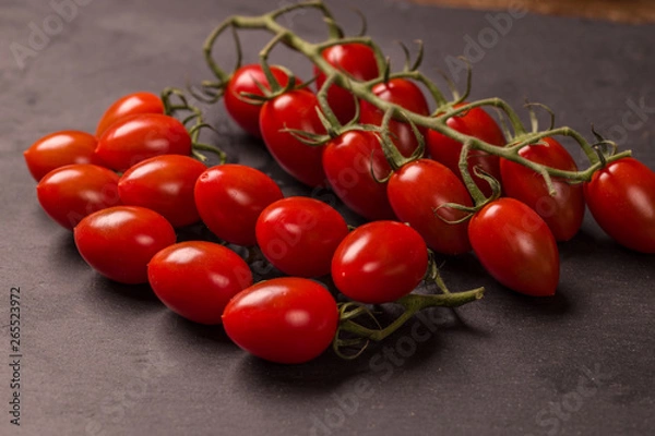 Obraz Tomato on black background