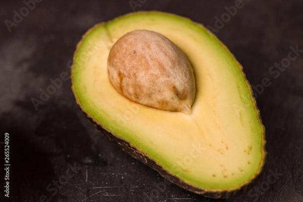 Obraz Avocado on black background