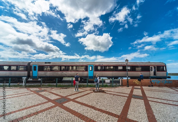 Obraz The train travels along the coast in the Portuguese city of Faro.