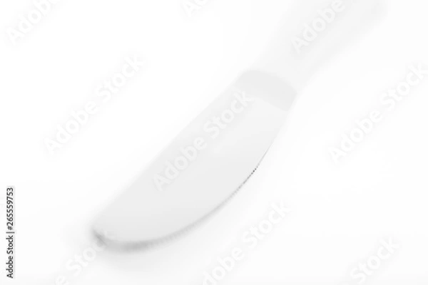 Fototapeta Knife with bokeh in high key with bright setting on white table