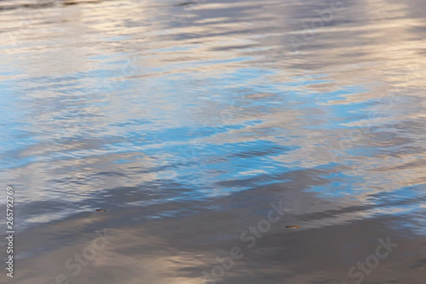 Fototapeta Reflection of the sky on the surface of the water