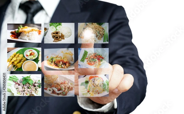Fototapeta Businessman hand making selection of food menu with digital touch screen