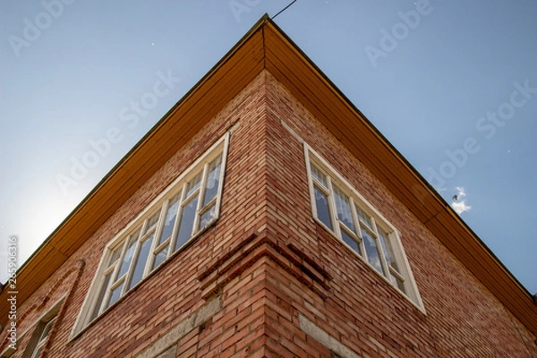 Fototapeta Red brick texture of the corner of the house. Red Brick wall for background or texture. Old red brick wall texture background
