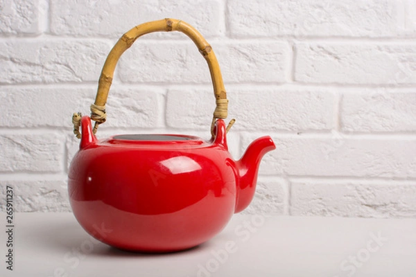 Obraz Red teapot closeup on the table.