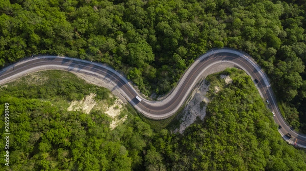 Fototapeta Directly above view: of cars driving on zig zag winding mountain road