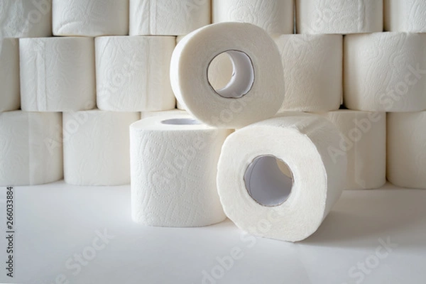 Obraz three rolls of toilet paper on toilet paper background