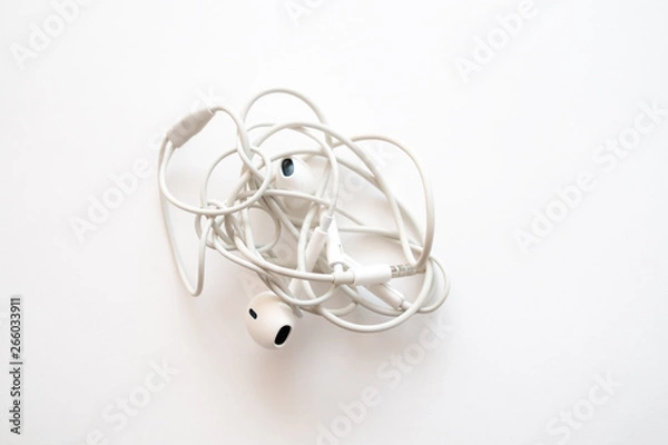 Obraz headphones on a white background the wires of the headphones are tangled