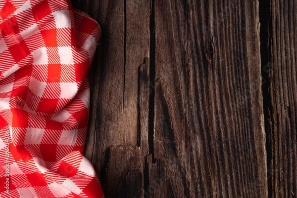Fototapeta red tablecloth on wooden