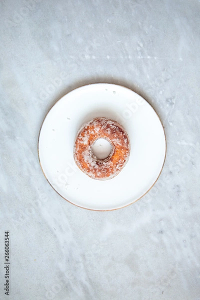 Fototapeta Finnish traditional Vappu food 1st of May, sugar donuts with sima on marble background with copy space