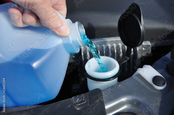 Obraz Filling the Windshield Washer Fluid