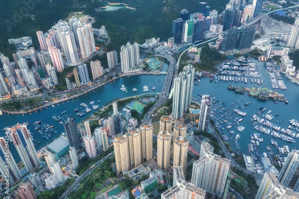 Fototapeta Landscape from top view see the Floating House and local boat around Aberdeen bay estuary with Buildings at southern of Hong Kong
