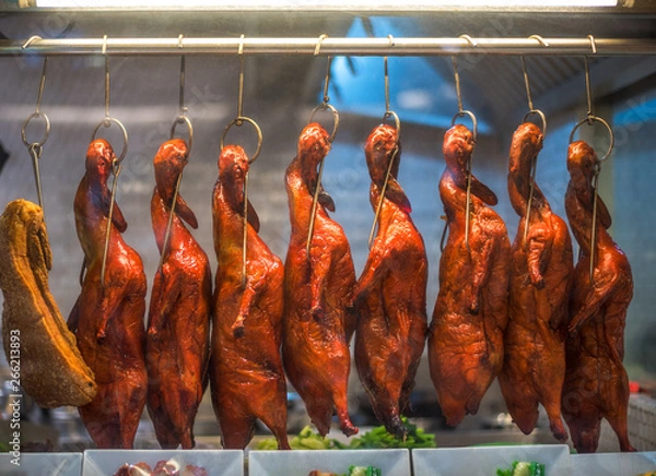 Fototapeta Tasty Roast Duck Hanging in Restaurant