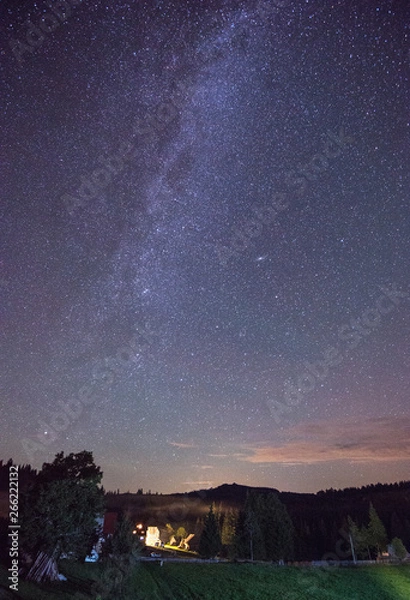 Fototapeta The Milky Way rising over the Carpathian Mountains, Romania
