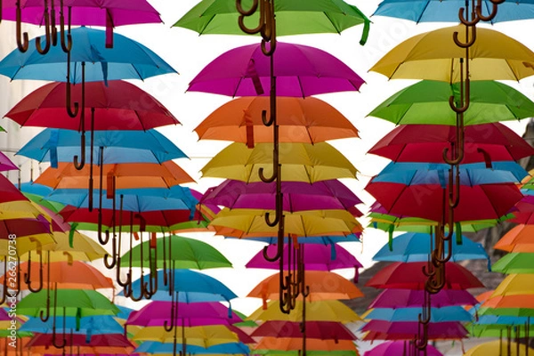 Obraz Colorful umbrellas background. Colorful umbrellas in the sky. Street decoration.