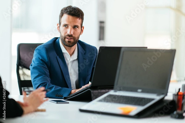 Obraz Colleagues working together. Managers at the meeting. Colleagues getting ready for conference.