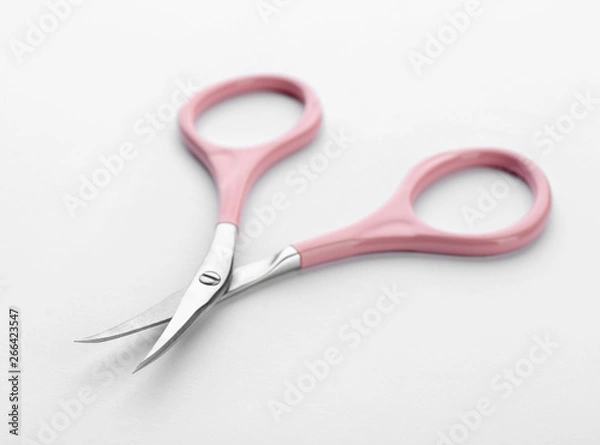 Fototapeta Pair of nail scissors on white background