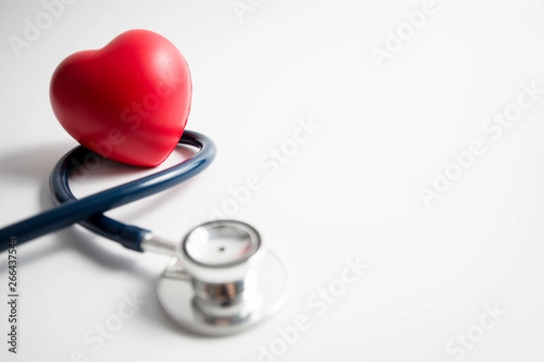 Obraz Red heart with stethoscope on white background