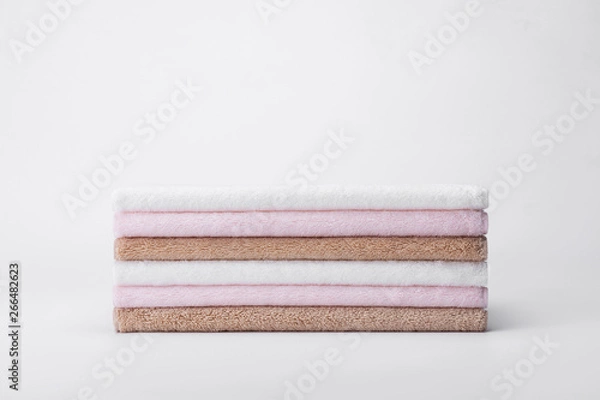 Obraz Stacked white, pink, apricot towels