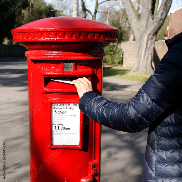 Obraz Traditional British red post box in an residential area.