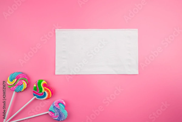Obraz Multicolored lollipops on a pink background