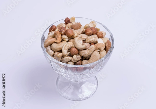 Fototapeta A mixture of cashew nuts, almonds, hazelnuts in a wine glass
