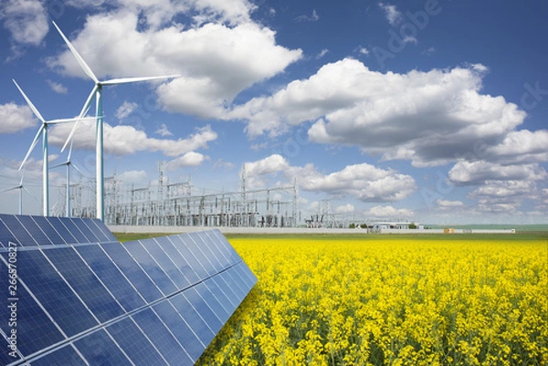 Fototapeta Green energy and transformer substation in a natural environment with blue sky and yellow rape field
