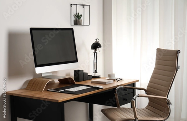 Fototapeta Stylish workplace interior with modern computer on table. Mockup for design