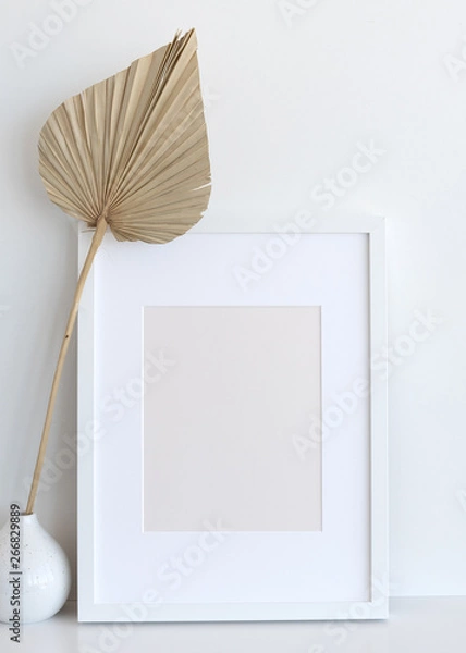 Fototapeta Picture Frame on Shelf with Palm Fan Decor - Mock-Up for Print/Poster/Graphic Design. Blank and Empty Frame - 8x10, 12x16 inches or Similar Ratio