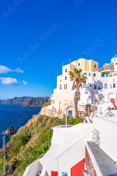 Fototapeta Santorini landscape with traditional whitewashed houses and view of Aegean Sea in Oia, Greece