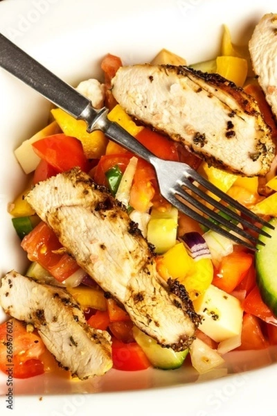 Obraz Chicken meat with vegetables. Chilli peppers marinade. Grilled food. Protein diet. Food for athletes.