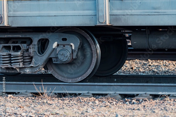 Fototapeta Railway carriage stands on the rails. Wagon wheels. Rails.