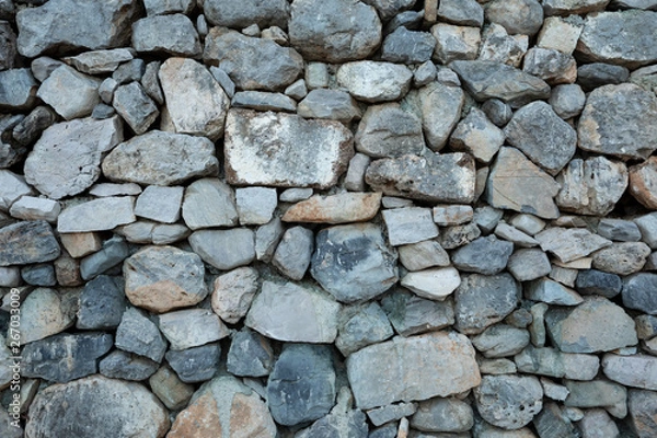 Fototapeta Background of natural stone wall texture photo.
