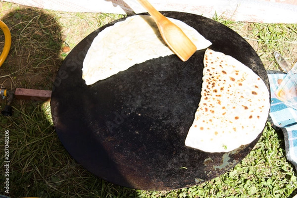 Obraz Cheese and spinach gozleme baked on sheet iron