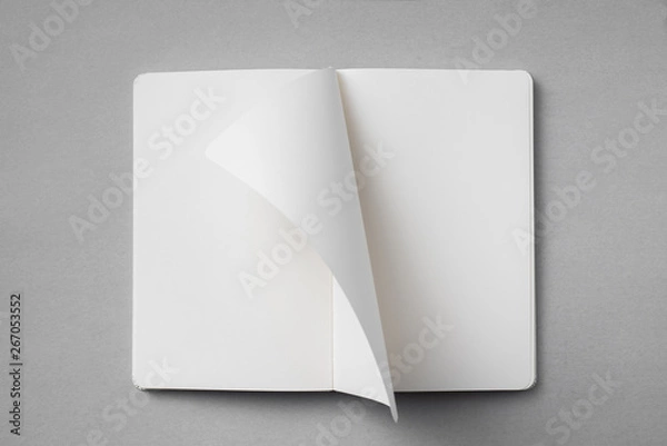 Fototapeta white notebook with turn page on grey background